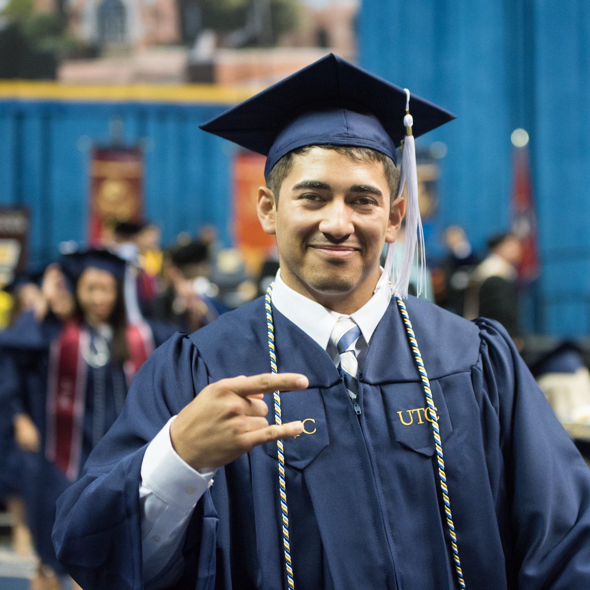 UTCCareer's tweet photo. Congrats to all of the students participating in commencement today! Best wishes as you continue on in your journey! #OnceAMoc #RepTheC #UTCgrad #UTCCareer [Image Description] Male undergraduate student in UTC's graduation processional displaying a Power C with his hand. https://t.co/PJdYxGvyK3