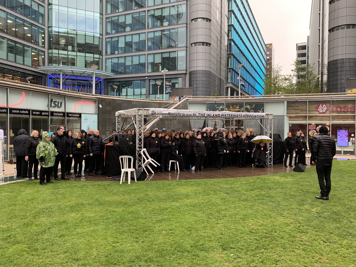 csogilvie's tweet photo. Rain (or hail) doesn’t stop Rock Choir. @canalcavalcade https://t.co/u0nw7x93YA