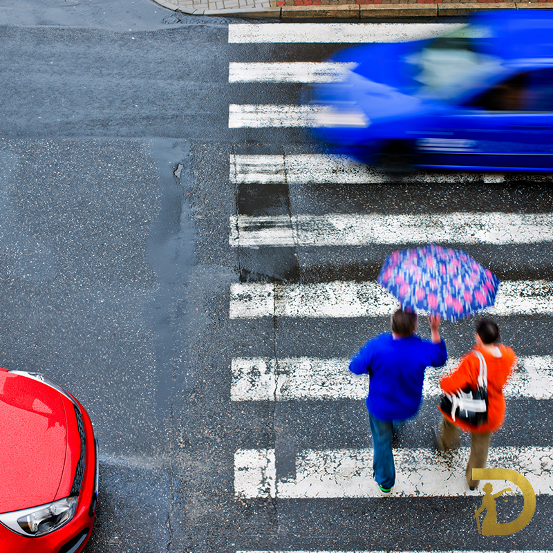 Rain makes it harder to see pedestrians. Drive slow and keep your eyes up.