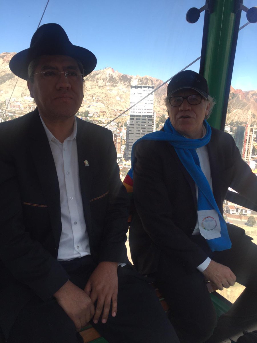 Almagro_OEA2015's tweet photo. En el teleférico de #LaPaz junto al canciller @DiegoPary, un sistema de transporte colectivo que moviliza a 300.000 personas al día, a un costo menor a medio dólar que ha revolucionado el transporte colectivo en la urbe principal de #Bolivia https://t.co/1TmOBE9o7Y