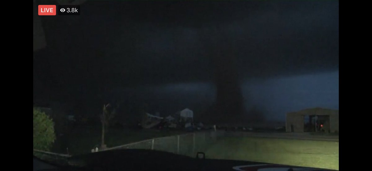 LaceySwope's tweet photo. Large long track tornado still on the ground headed toward Ford, Kansas. This thing has overturned semis, and hit homes! 9:17 PM. 

Val and Amy are tracking it. #okwx @NEWS9 @valcastor https://t.co/d2egHRT6Ke