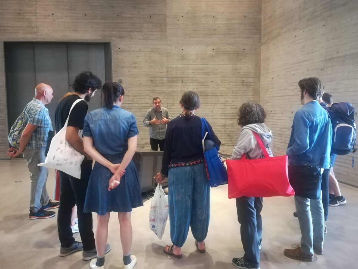 C3A_Andalucia's tweet photo. Empieza el taller con #fernandosanchezcastillo los participantes con los materiales para el taller delante de una de las barricadas del artista https://t.co/9I59ANc97c