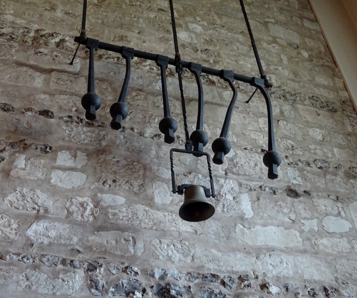 Interior of Wargrave church...I looked into the bell tower ground floor room.  Well worth it.  Very attractive layers of stone (chalk?) &amp; flint with some lovely textile art #AnimalsInChurches (left).  But what to make of this unusual display of clappers (right)?  <a href="/LandscapeIan/">I</a>