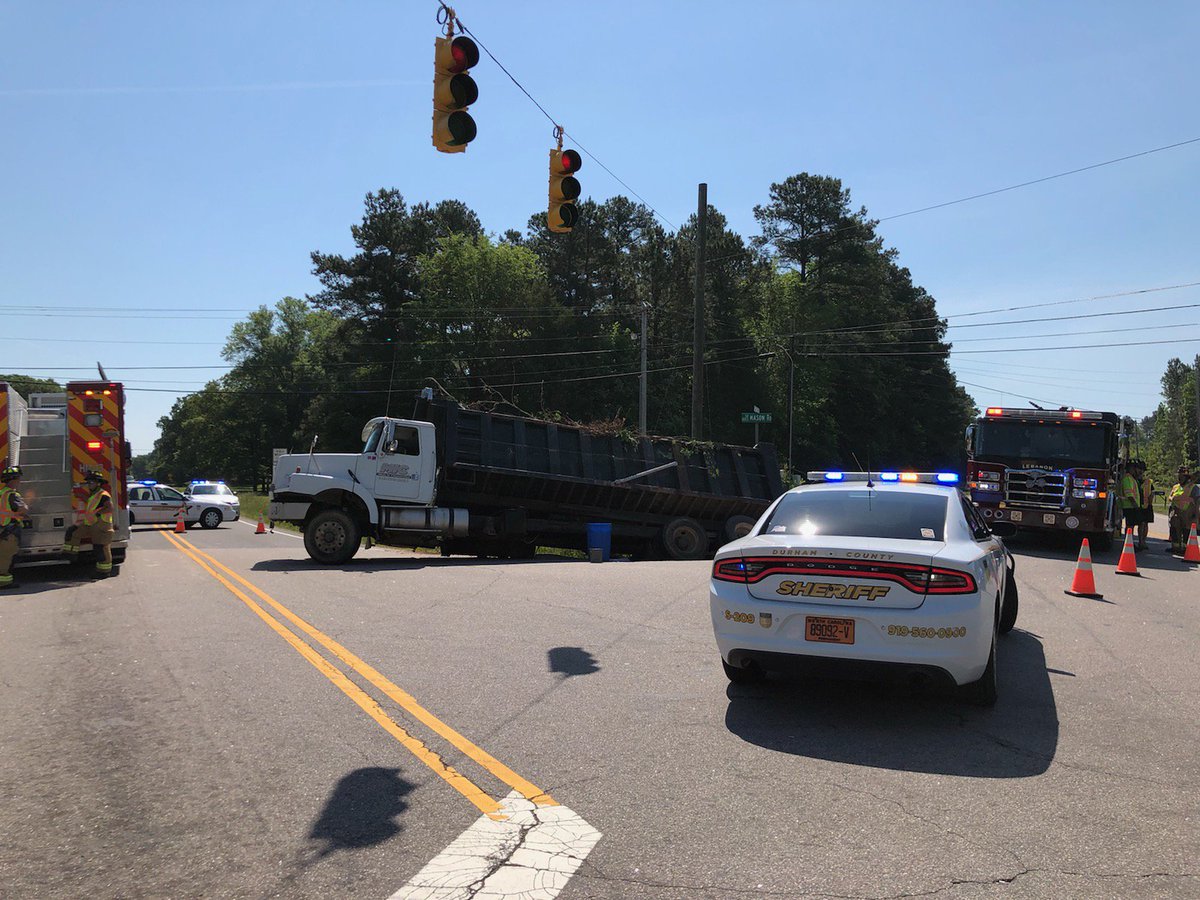 DurhamSheriff's tweet photo. #TRAFFICALERT Deputies and fire on on scene of an accident at #GuessRd and #MasonRd. A dump truck went into a ditch and is leaking fluids. Avoid the area as clean-up will take some time. https://t.co/RATVa3dah7
