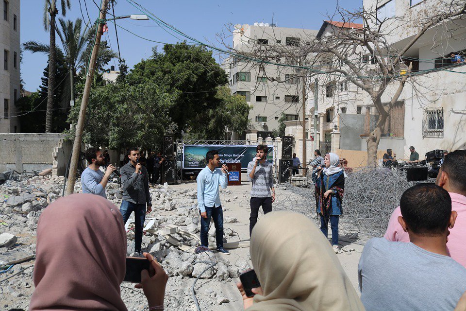 WeAreNotNumbers's tweet image. Congratulations to Jehad Shehada , who won our #GazaVision song contest today, and thanks for all the singers who sang for Palestine during the winner announcement's event which took place on the rubble of a building that was destroyed by the Israeli warplanes weeks ago in #Gaza.