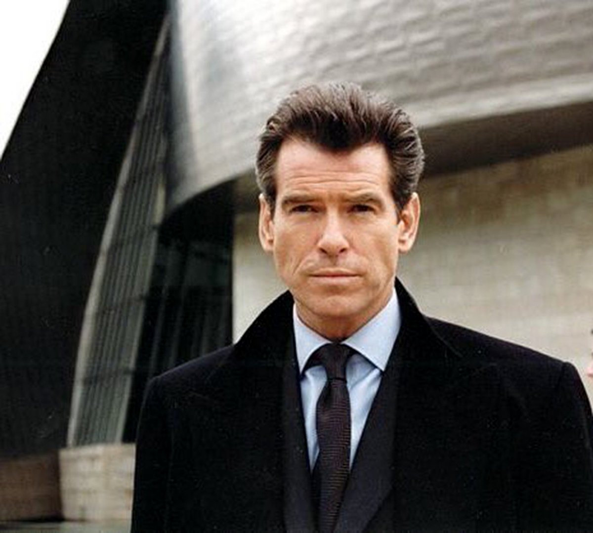 A Charcoal DoubleBreasted Overcoat for a Funeral in The World Is Not