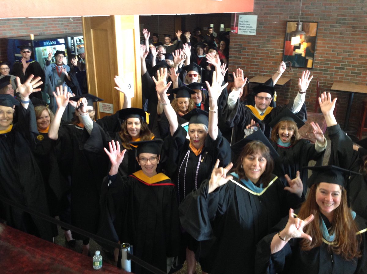 NorthernEssex's tweet photo. Not sure who is more excited: our faculty or our graduates? Put your hands in the air to show that you care!👏🏼✨ #NECC2019 https://t.co/9r6iui4iTw