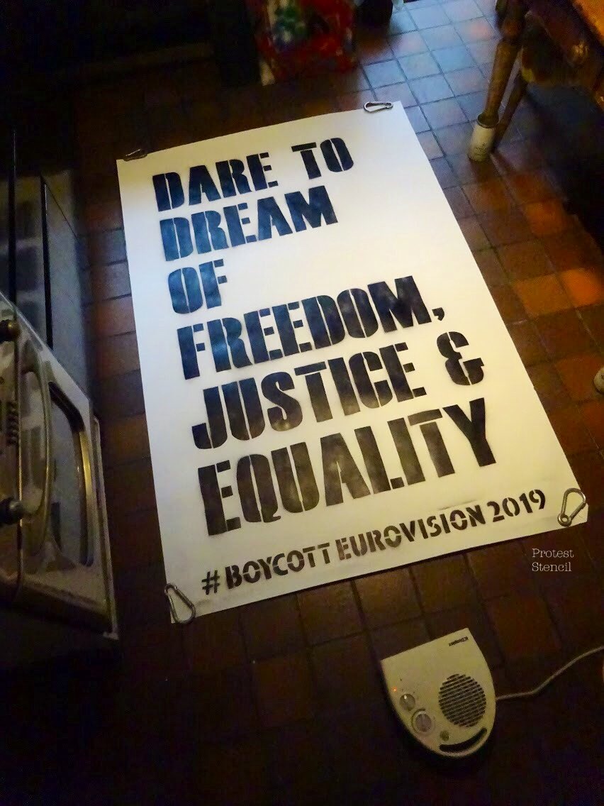 Stencilled poster reading ‘Dare to Dream of freedom, justice & equality’