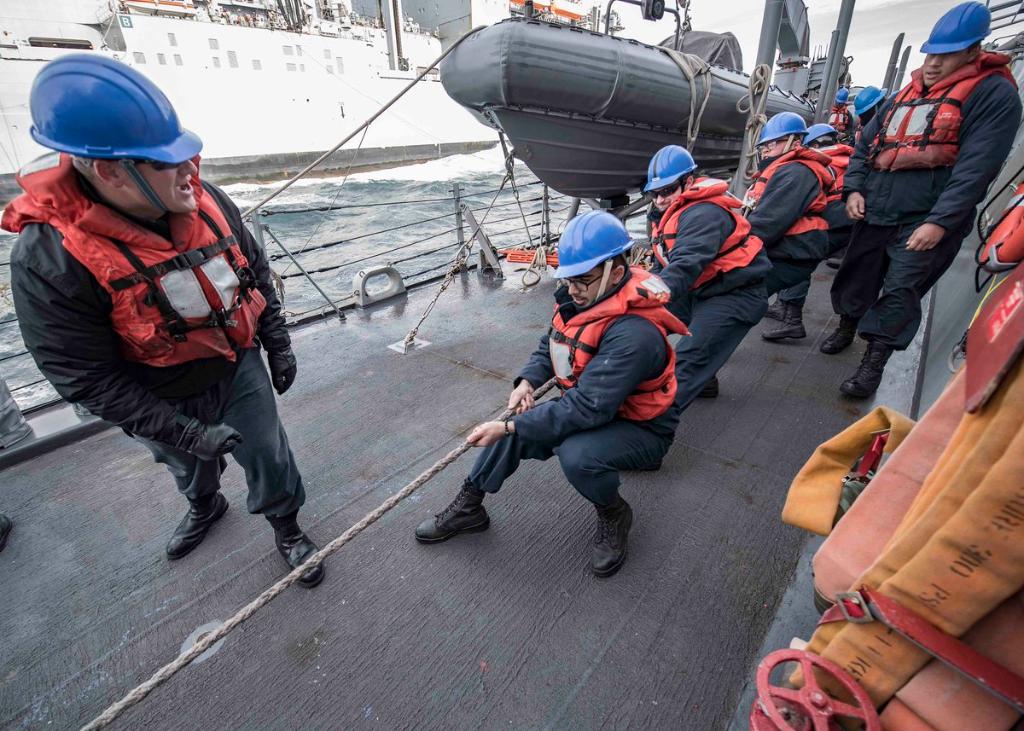 USNavy's tweet image. MT @USNavyEurope: One, two, three – heave! 
Sonar Technician 2nd Class Austin Ward issues a heaving command as the line petty officer in-charge during a replenishment at sea evolution aboard #USSCarney during #FormidableShield 2019.