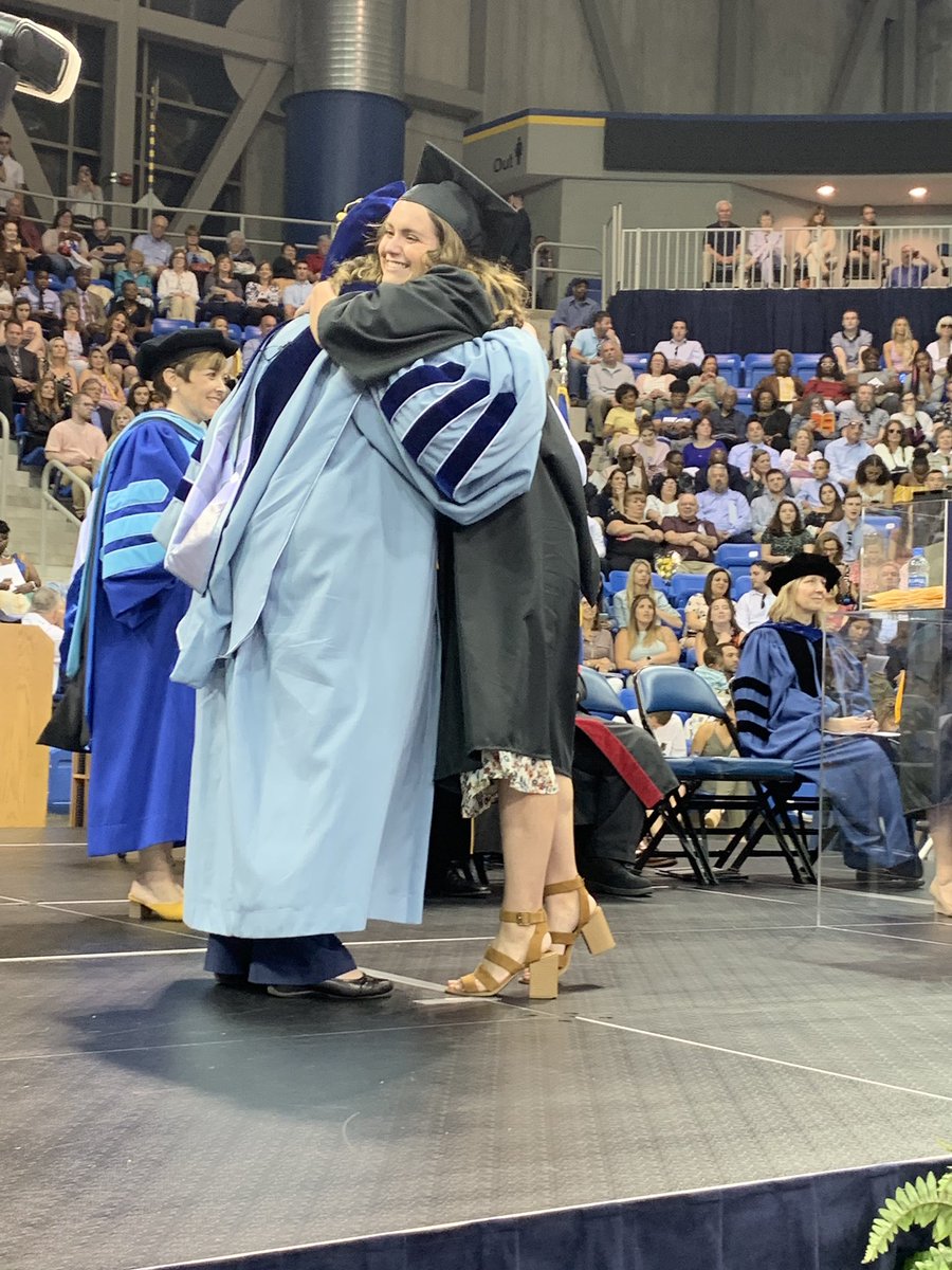 QUJournalism's tweet image. .@sam__bashaw just graduated! (And got a big hug from interim dean Terry Bloom.)