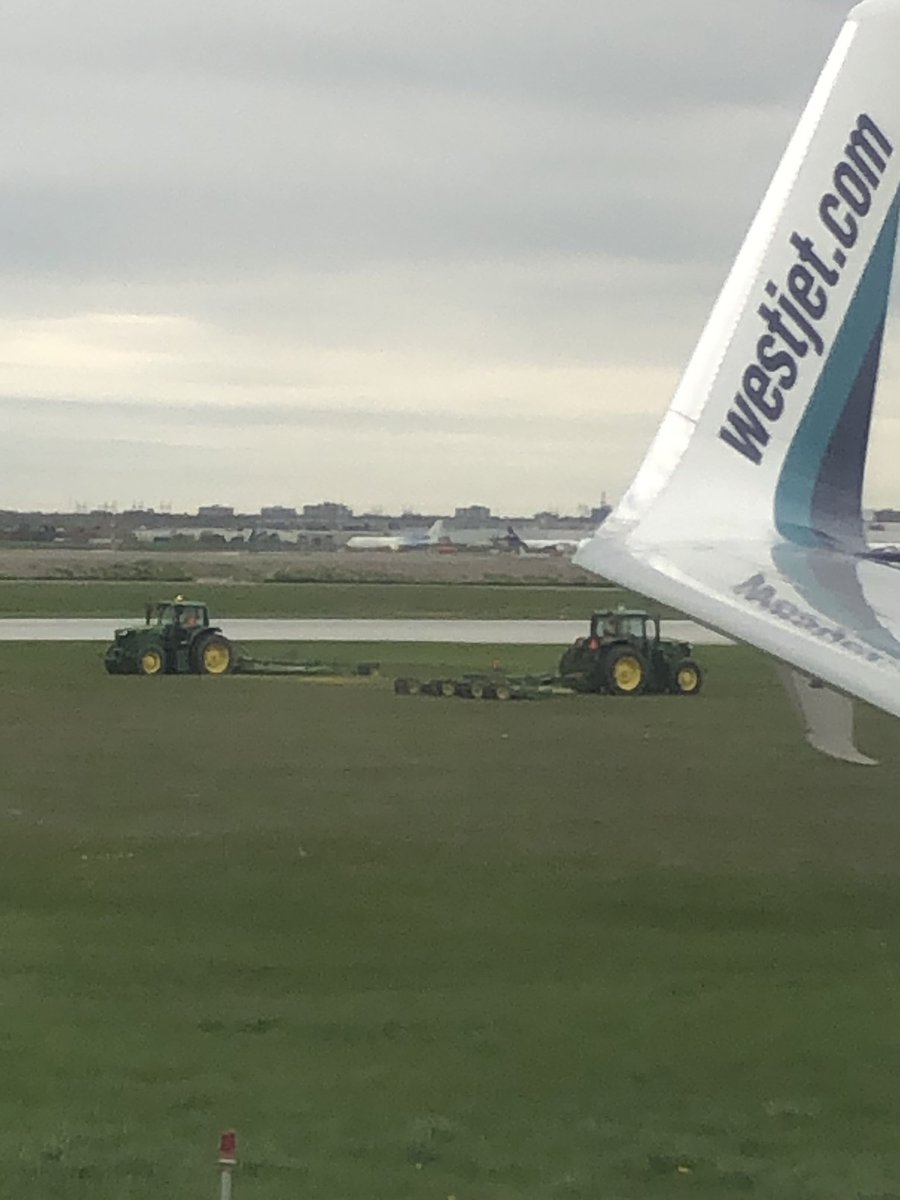 FrontlinkInc's tweet photo. Nice suprise touching down with @WestJet in @TorontoPearson this afternoon! Nice pair of @JohnDeere tractors with @ZuidbergNA front hitches - keeping the grounds looking top shelf. ππͺππ #thinkahead #WS428 https://t.co/CDGMCnbvhB
