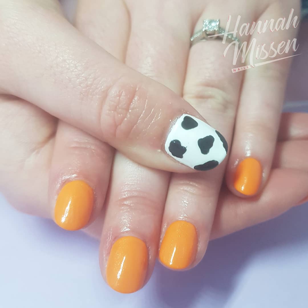 Hannahmnails's tweet photo. Shellac mani in 'Gypsy' with cute #cowprint accents 🧡🐄 #cowprintnails #shellacnails #orangenails #showscratch #southendonsea #leighonsea https://t.co/kWUcL6VOlO