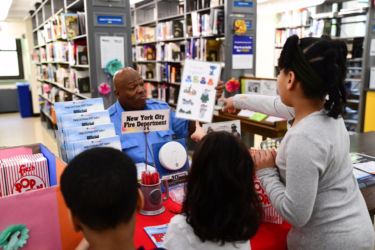 FDNY's tweet photo. #FDNY Fire Safety Education Unit and members from #Engine207 taught kids to be #FDNYSmart today at the Walt Whitman Branch of the @BKLYNlibrary. To see online tips for keeping you and your family safe, visit https://t.co/NpwdRdlElY https://t.co/UxOEQh2naC