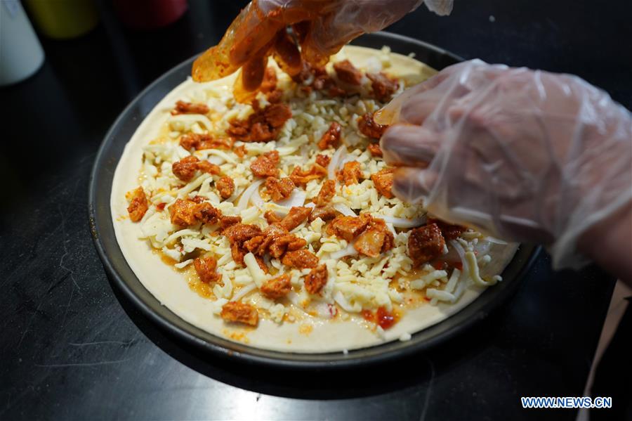 CGTNRadio's tweet photo. Cooks make delicious food during the Asian Cuisine Festival, a part of the Conference on Dialogue of Asian Civilizations (#CDAC), in Beijing. #Asiancivilizations  https://t.co/Jzr6keNUn9 https://t.co/B8VHbroaap