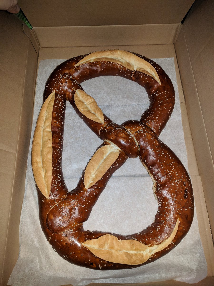 recent5's tweet photo. Thinking I could easily eat this 20"x14" giant pretzel is one of my dumbest ideas in a long time. #biggerthanexpected https://t.co/pkQ1T81zZr