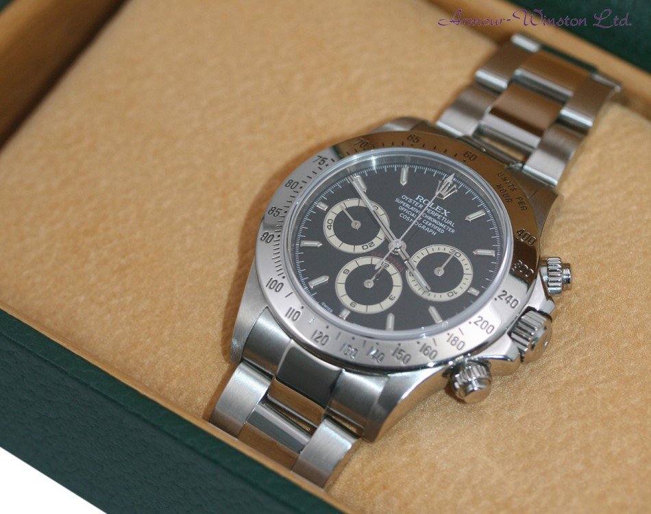 armour43's tweet photo. RARE! Final version of the lauded Rolex 16520 Zenith Cosmograph Daytona chronograph watch. This watch is a tremendous example with black dial and is even rarer as it is totally complete with original box and papers from Rolex! https://t.co/ZCUEACDa70 https://t.co/iyZyEkaaGT