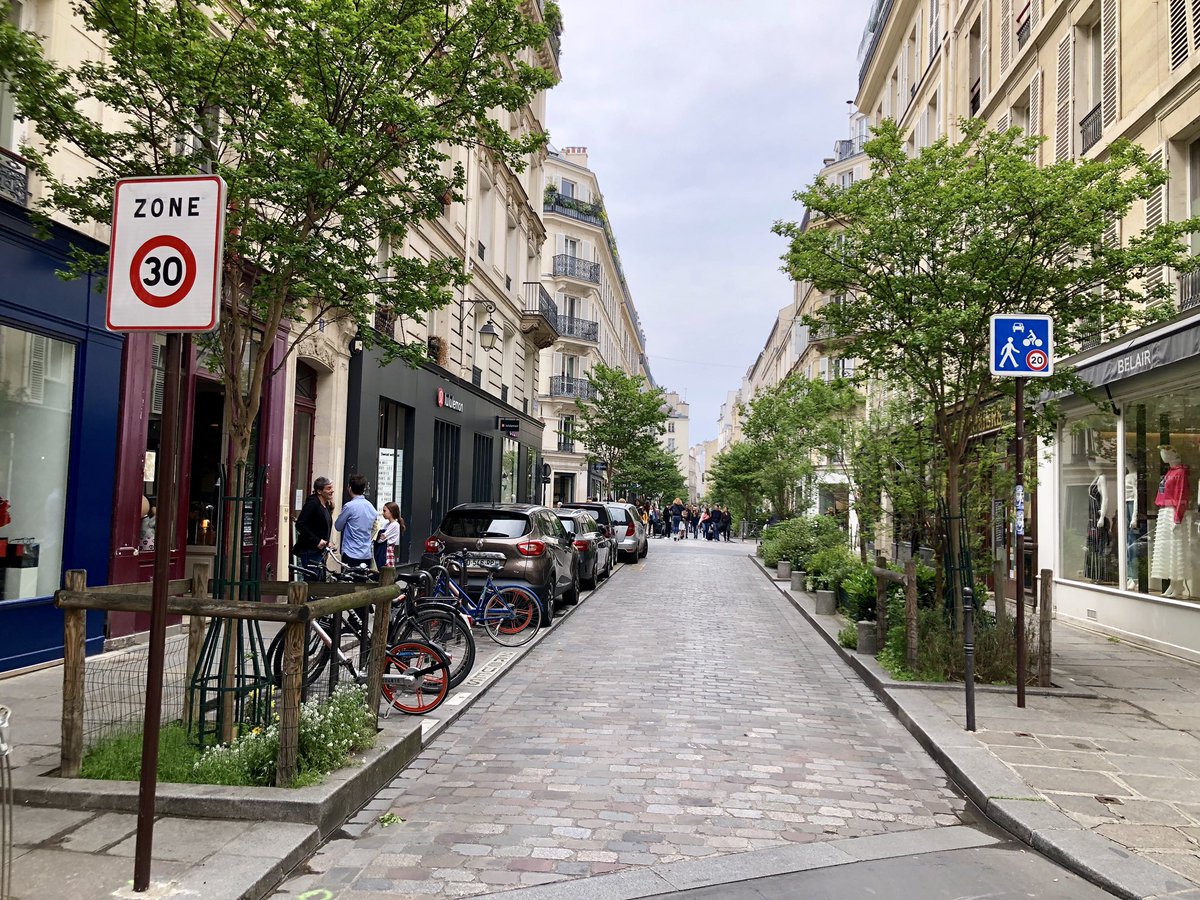 Cars aren’t banned from these Central  #Paris streets — but they’re tamed enough that every driver knows pedestrians are in charge. Like Dutch  #woonerfs, cars move at the pace of a strolling pedestrian. This isn’t hard — it just takes a rethink, & will.  #Paris  #streetsforpeople