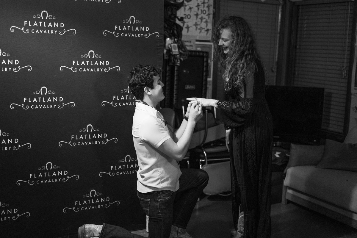 FlatlandCavalry's tweet photo. Cleto got down on one knee and did something crazy last night before our outdoor stage debut at Floore’s. We all love you two very much. Congrats y’all! 💍❤️ 

📸: @nandoman14 https://t.co/5deYhcVFuH