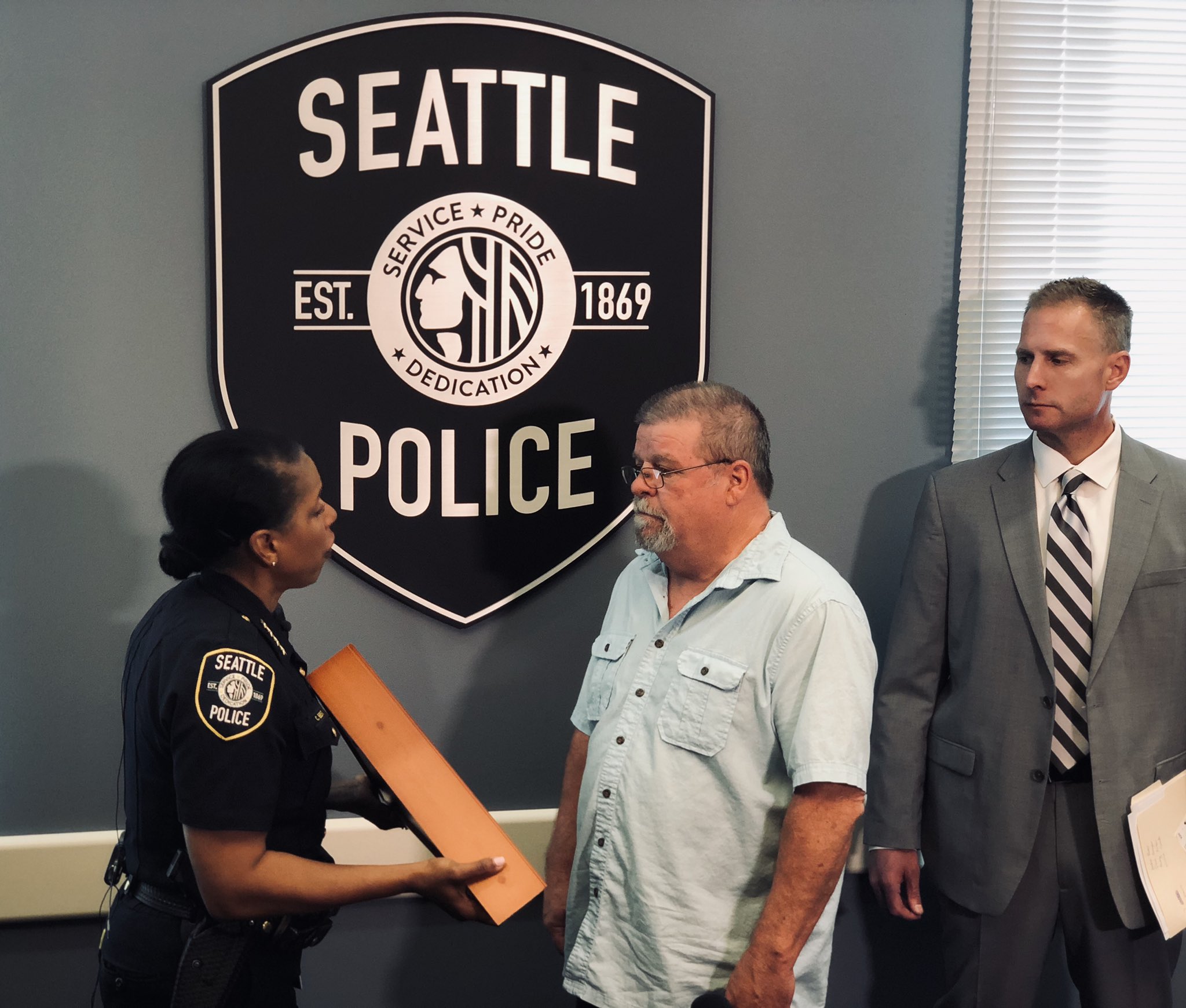Chief Carmen Best Ret En Twitter Honored To Present Chris Galvin With The United States Flag That Was Flying Over The Seattle Justice Center The Day Detective Rolf Norton Solved The Murder