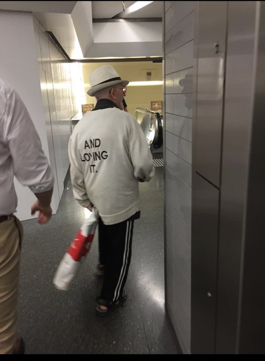 Some old fella is walking around the train station wearing this 😂😂