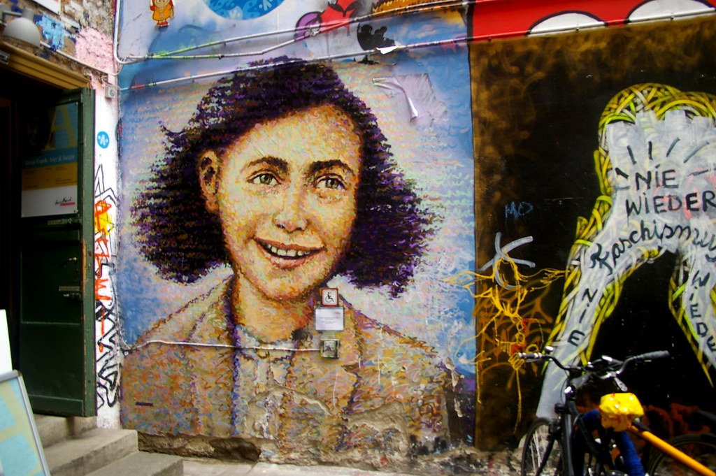 Anne Frank portrait by the English artist Jimmy C. on the wall outside the Anne Frank exhibition in Berlin 2014.