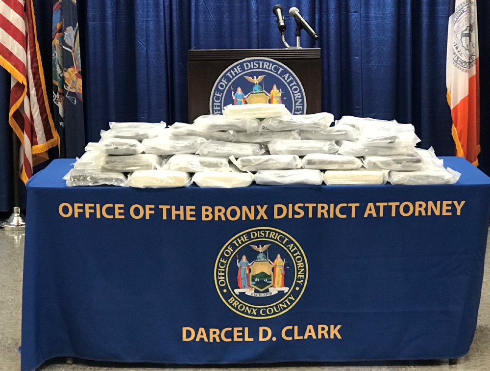 Table with 176 pounds of packaged cocaine.