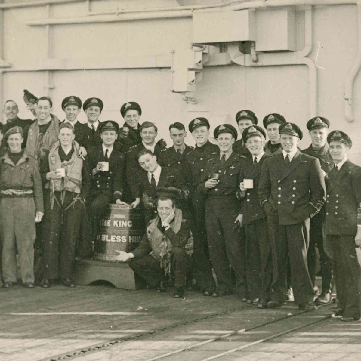 NatMuseumRN's tweet photo. Today marks #VEDay as we look through our archive for VE Stories. Below shows air staff from #HMSSearcher embracing this well-earned rum barrel. They were part of the home fleet covering force that liberated Copenhagen in the first week of May 1945. Here's to you! #RumTot https://t.co/QDTJ9HFF95