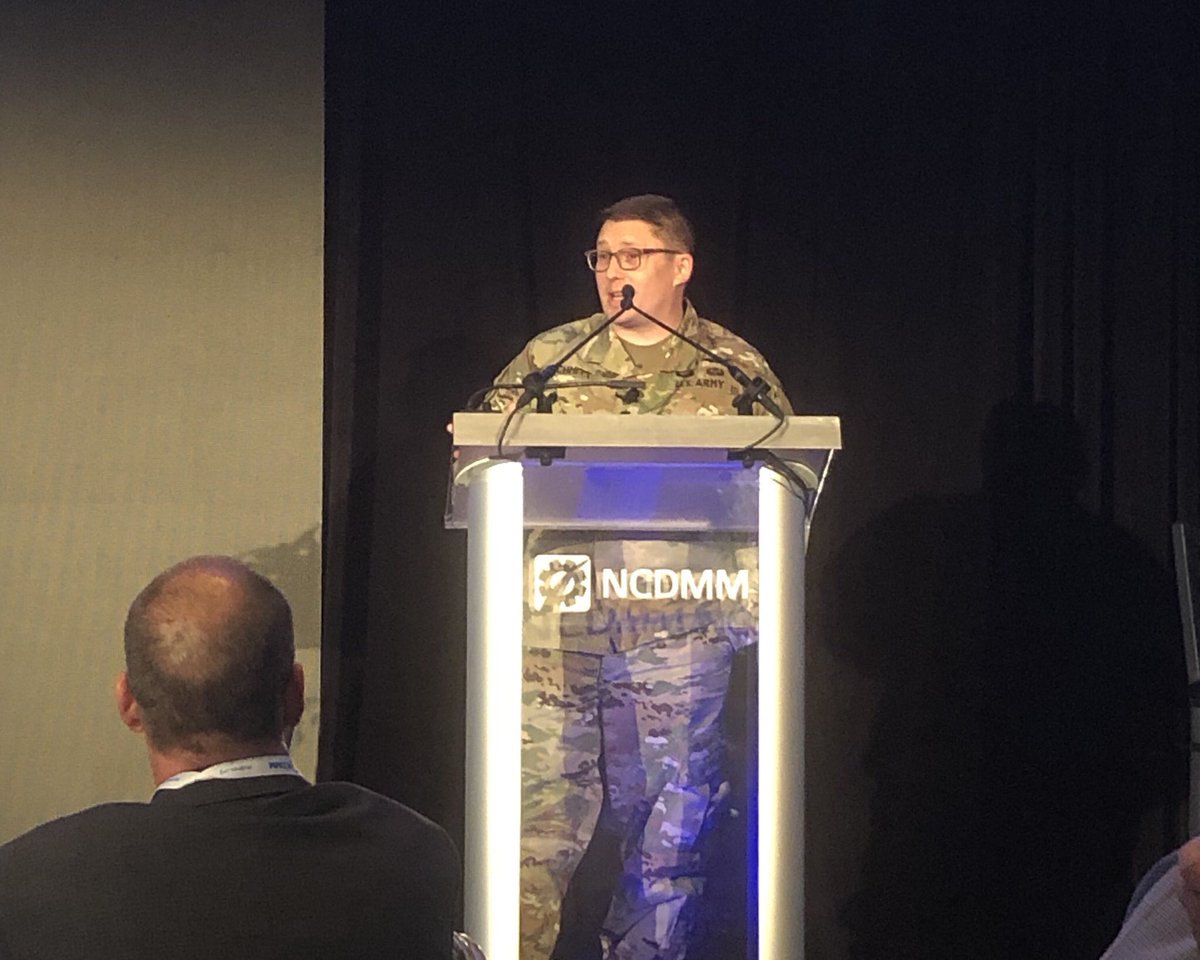 DEeditor's tweet photo. LTC John Schmitt, US Army, who is developing the next-gen heavy lift cargo helicopters, presents at the #NCDMMsummit Technology does not necessarily mean dominance. Manufacturing wins wars. @AmericaMakes @NCDMM https://t.co/mJ72PZB0Ba