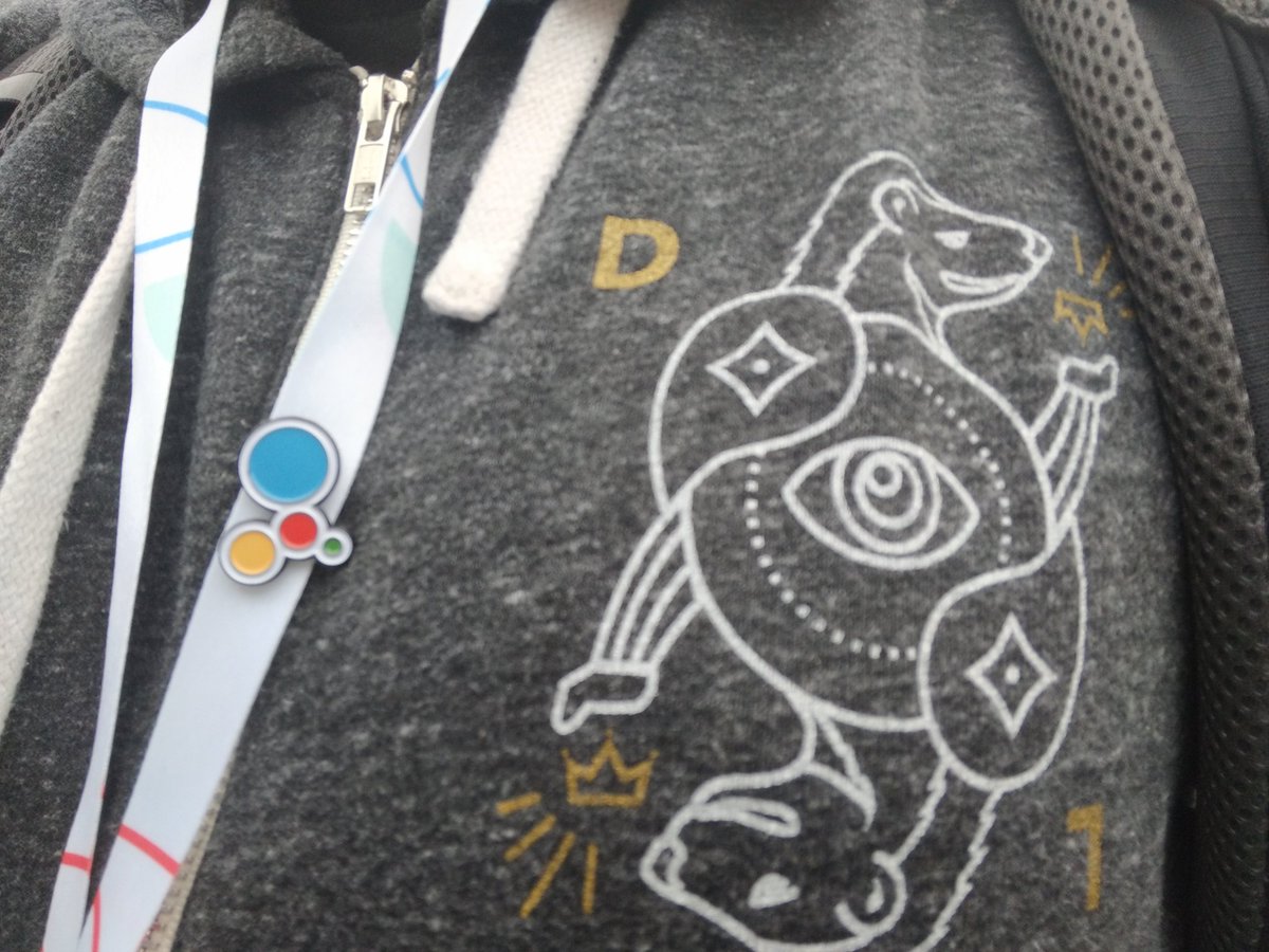 Closeup of Google Assistant logo pin and Detroit Labs hoodie