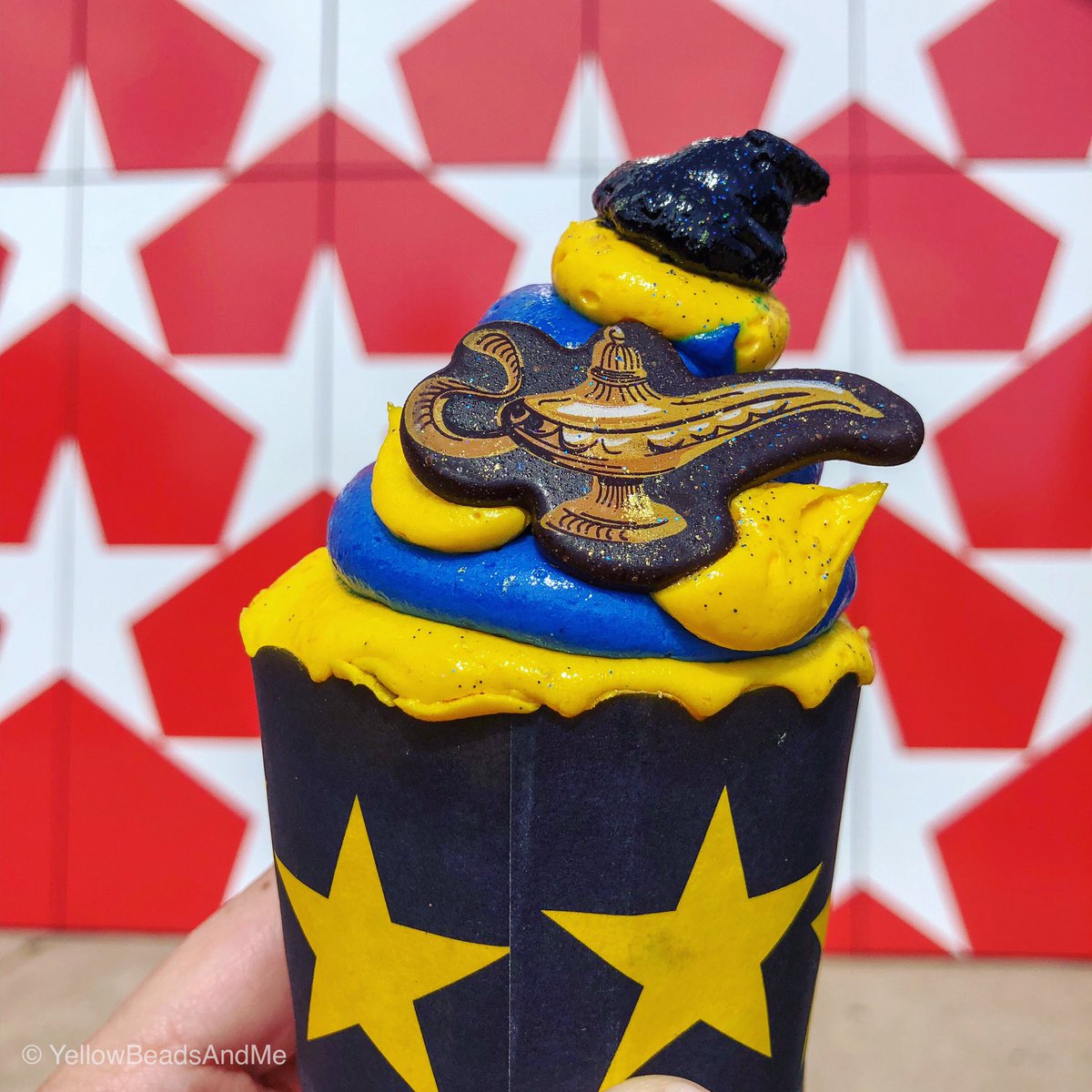 ItsJenDixon's tweet photo. A new #AladdinGenie cupcake has flown in to All-Star Music Resort. It is a chocolate cupcake with a lemon lime flavored icing, topped off with a chocolate magic lamp! https://t.co/R2GcKsWAI4