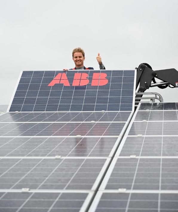ABBgroupnews's tweet photo. F1 World Champion @nico_rosberg is committed to cleaner energy. Yesterday he was at the energy self-sufficient factory from #ABB Busch-Jaeger in Luedenscheid and put the last needed solar panel on the roof. https://t.co/jD7nkbR7W4 via @BILD #MissionToZero #FutureOfEnergy https://t.co/oJObopekes