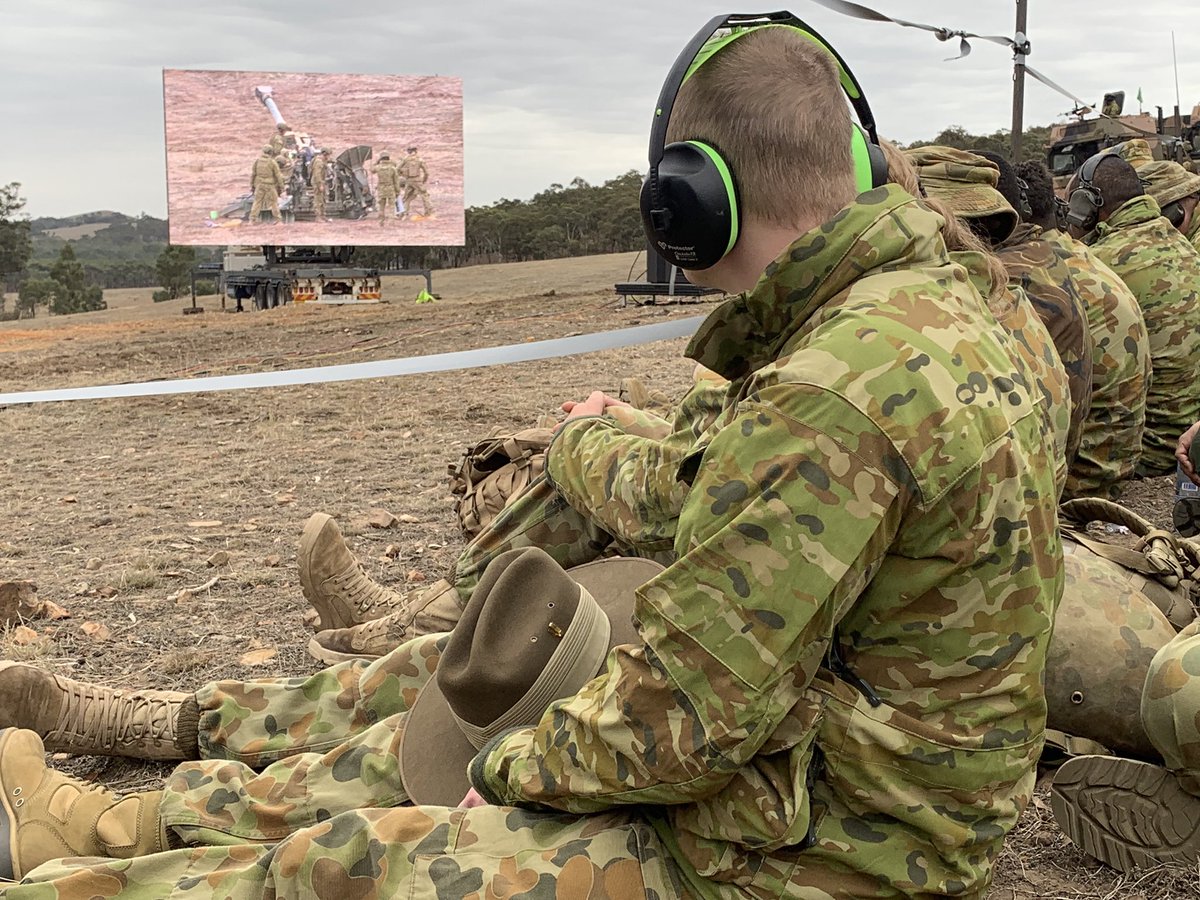 FORCOMDAusArmy's tweet photo. This incredible display system setup is allowing the audience a close up view of all the action at Exercise #ChongJu. Here, a team from the School of Artillery demonstrates the use of an M777 Howitzer 155 mm artillery piece #OurTraining @SOArtyAusArmy @CATCAusArmy @AustralianArmy https://t.co/xLNEOU80rx