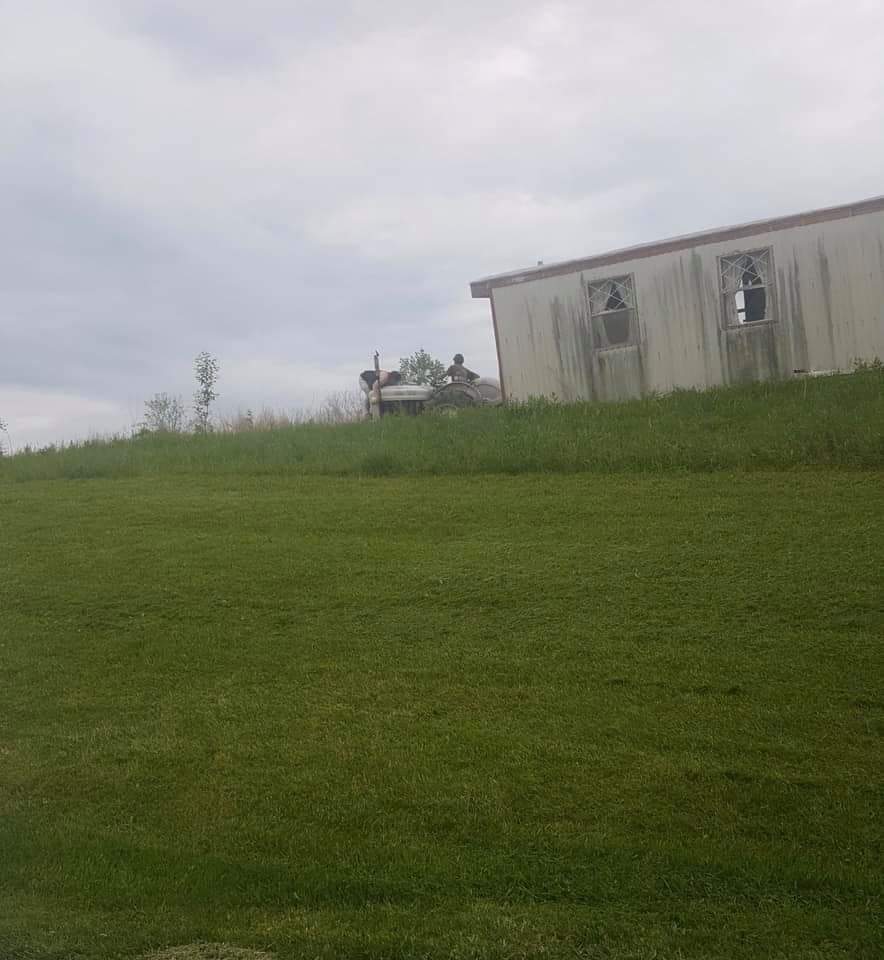 ChadBlue83's tweet image. Only in Piqua, Kentucky will you see a man on a tractor pulling a single wide trailer across a ridge with a woman laying on the hood trying to hold down the front end! 😅😂 Photo by Bradley Highfield.