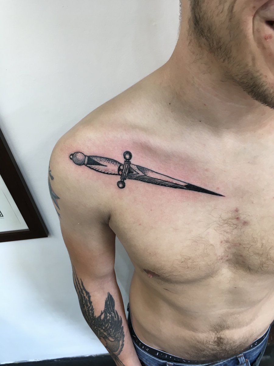 dagger in middle of chest tattooTikTok Search