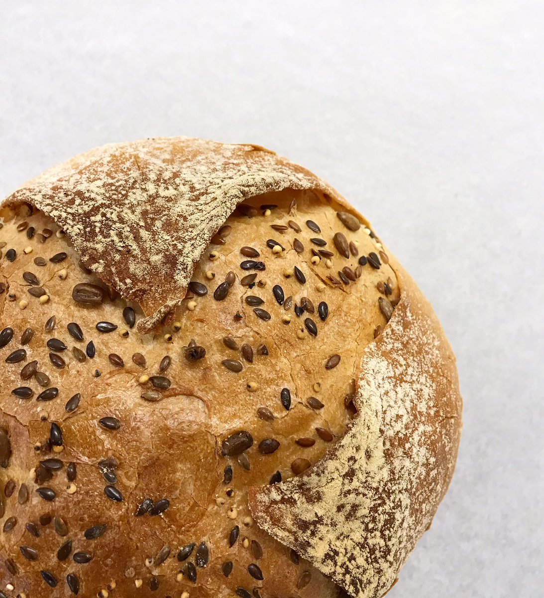breaducating's tweet image. So the final bread baked and cooled. Opens up during baking to show the seeds underneath. To see the step-by-step instructions to have a go yourself follow the link breaducating.co.uk/seeded-bread.h… #bread #baking #seeds