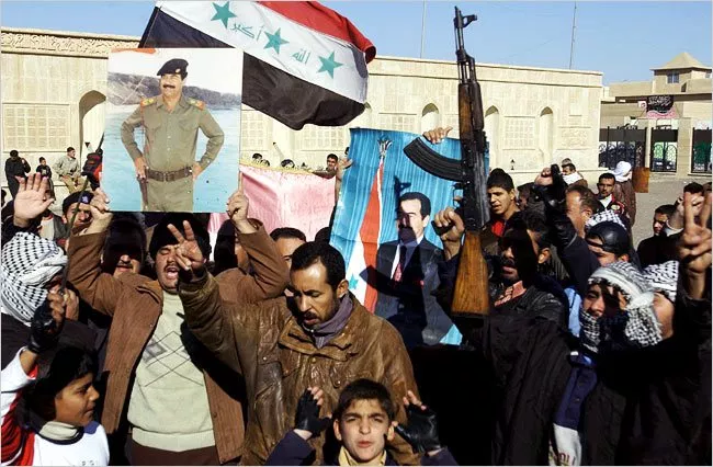 19 - Supporters of Saddam march in Tikrit. (2006)