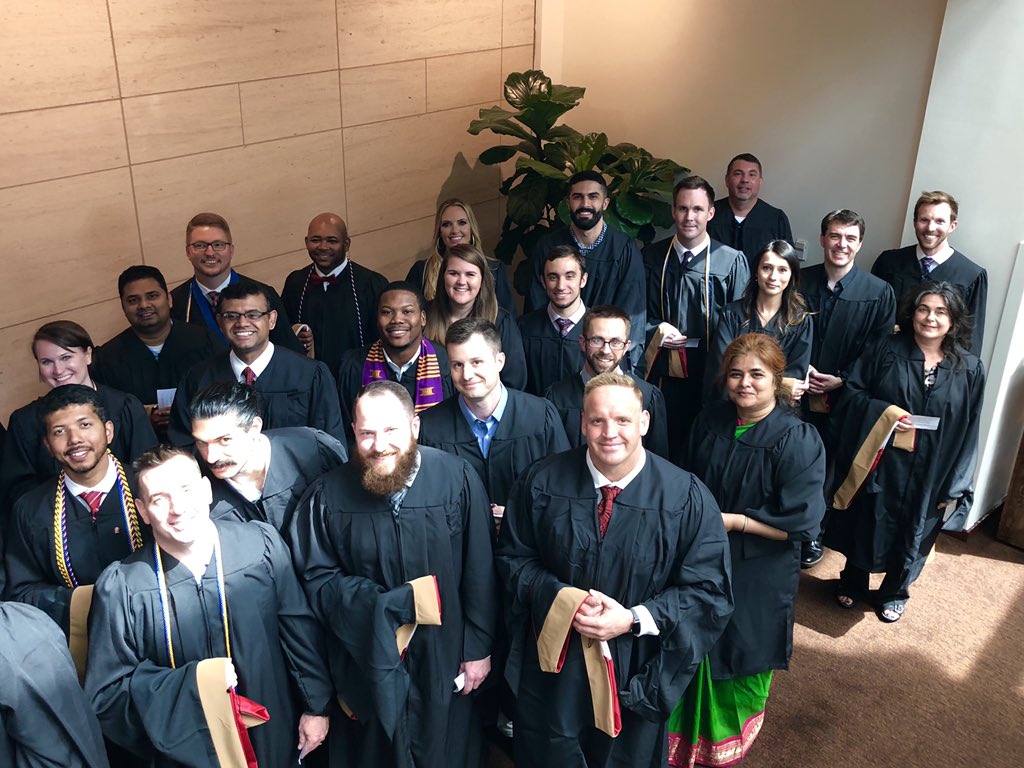 NCStateMBA's tweet photo. These #NCState19 #MBA grads are all smiles. 🎓🐺🐾 https://t.co/zUJhN8FkDw