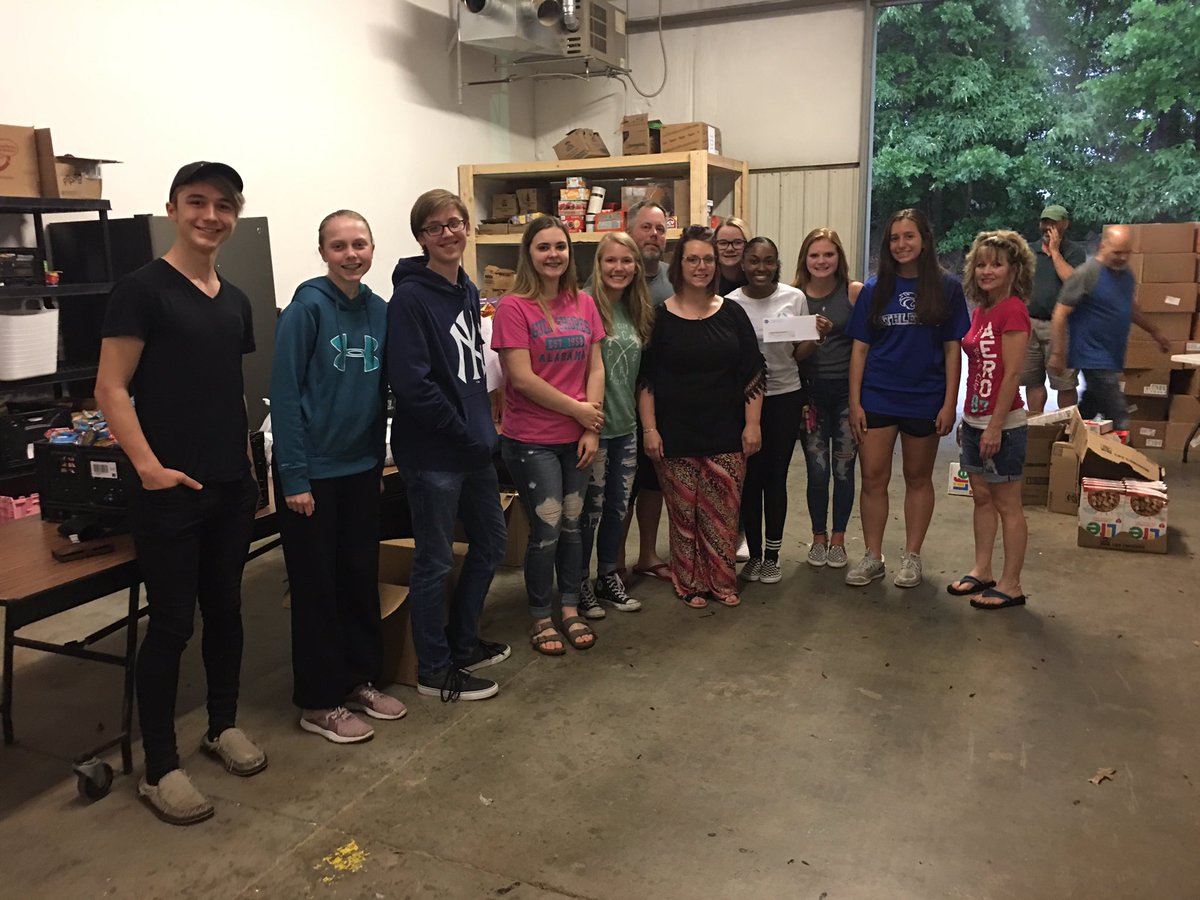 CatBt71's tweet photo. LGHS Chick-fil-A Leader Academy completed the final phase of their Impact Project tonight. They went to Operation Lunchbox &amp; packed groceries for food insecure students in their community &amp; presented Operation Lunchbox with a $1000 check. #impactthroughaction #operationlunchbox https://t.co/yXfhOKiXcY