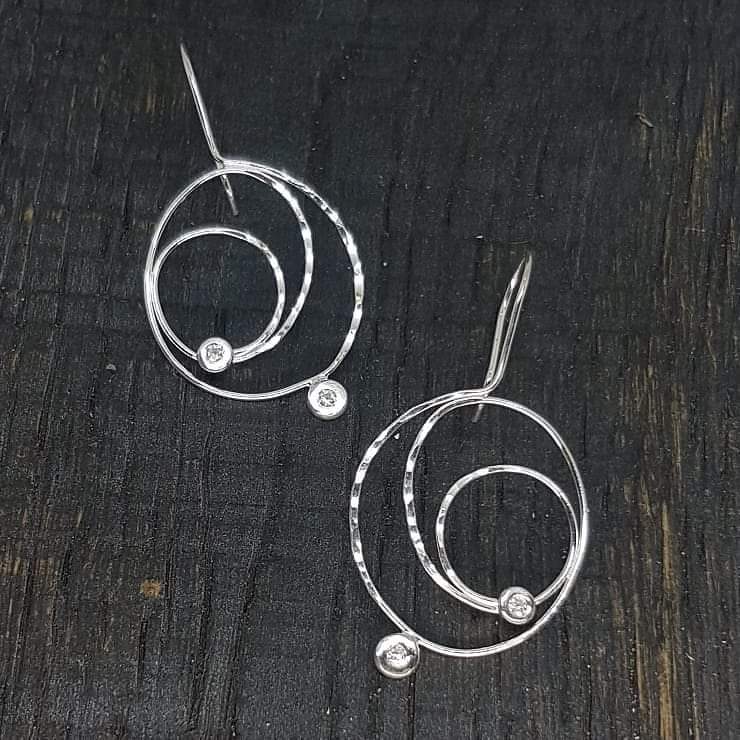 UPDATE - Sold to the lovely Ulrika :-)
NEW Not on the website yet, Pre website price £27 inc postage.

Handmade in silver with flush set CZ.

Any suggestions for a name ;-)
.
#artisanearrings #handmadesilverearrings #flushsetting #handmadefrombeginningtoend