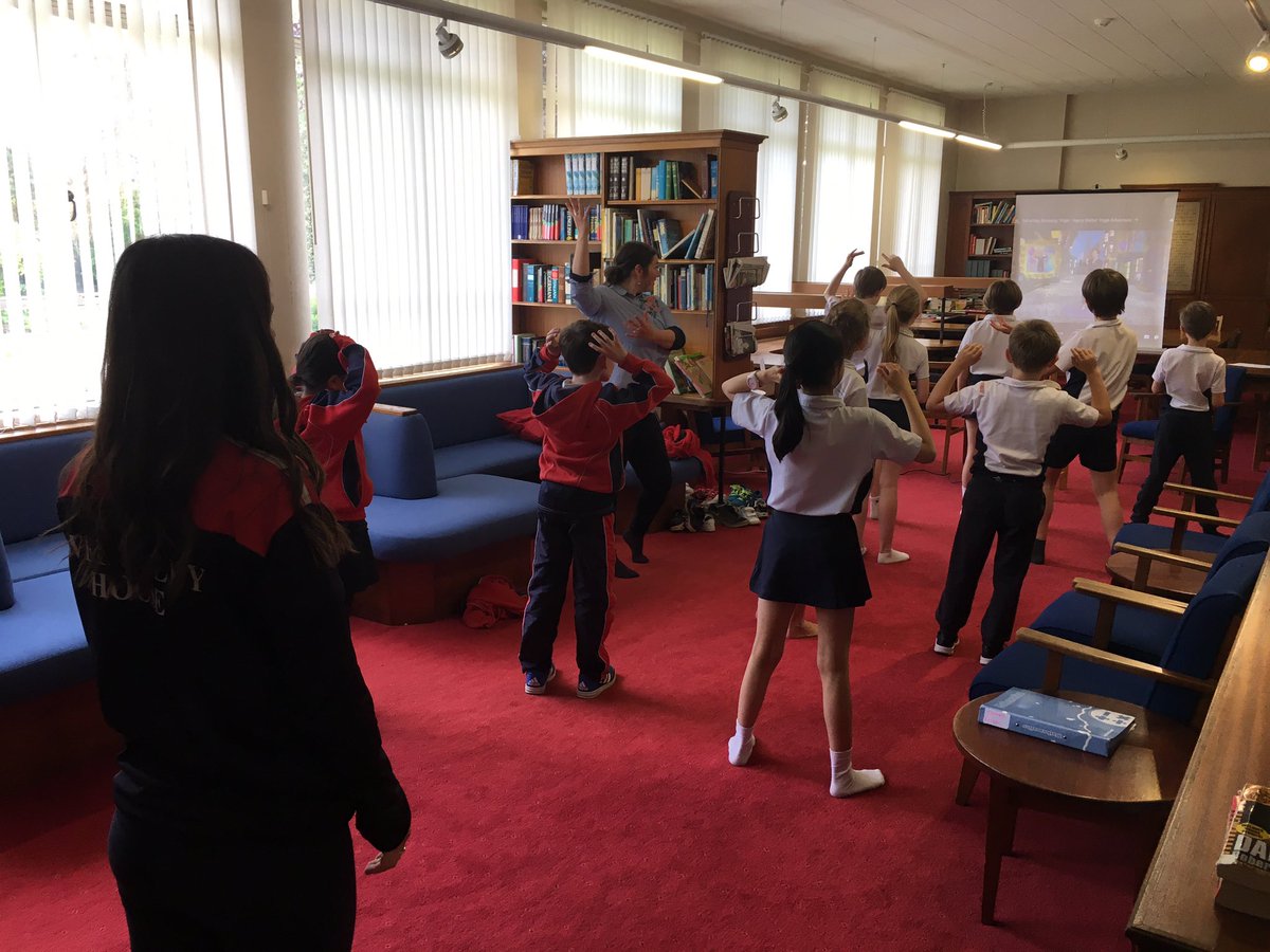 WellesleySchool's tweet photo. Our beautiful library serves many purposes! Some middle school pupils (and staff) enjoying yoga #BendAndFlex #HealthyBodyHealthyMind https://t.co/OVbwHVPIa5