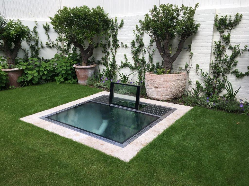 Useful combination Opening Cover for egress, ventilation and Walk-On Glass Floor bringing daylight to room below