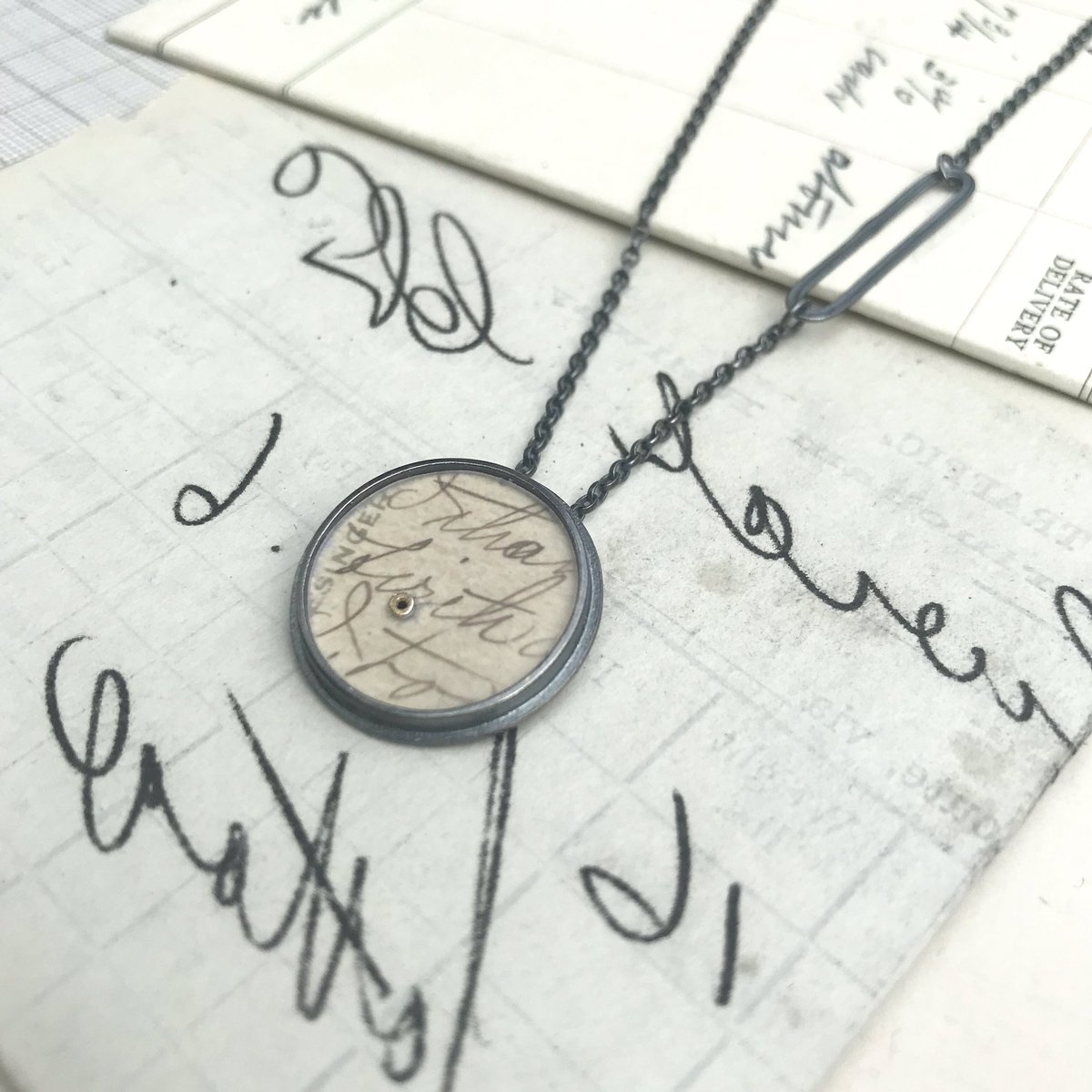 clarehillerby's tweet photo. Postcard Dot Pendant with long chain + lozenge link. Can be made using treasured papers that you’d like to archive + take with you in a new piece of jewellery 
#pendant #postcard #treasure #ephemera #oxidisedsilver #goldtuberivets #lozenge #handmade #upstairs #studio20a https://t.co/Akzmq1gdYV