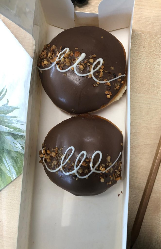 Tabitha_x's tweet photo. Colleague bought us all @krispykremeUK to find the two Nutella ones are different sizes. Heartbroken! Who gets the smaller one??!! https://t.co/ZK59zH8ZfL