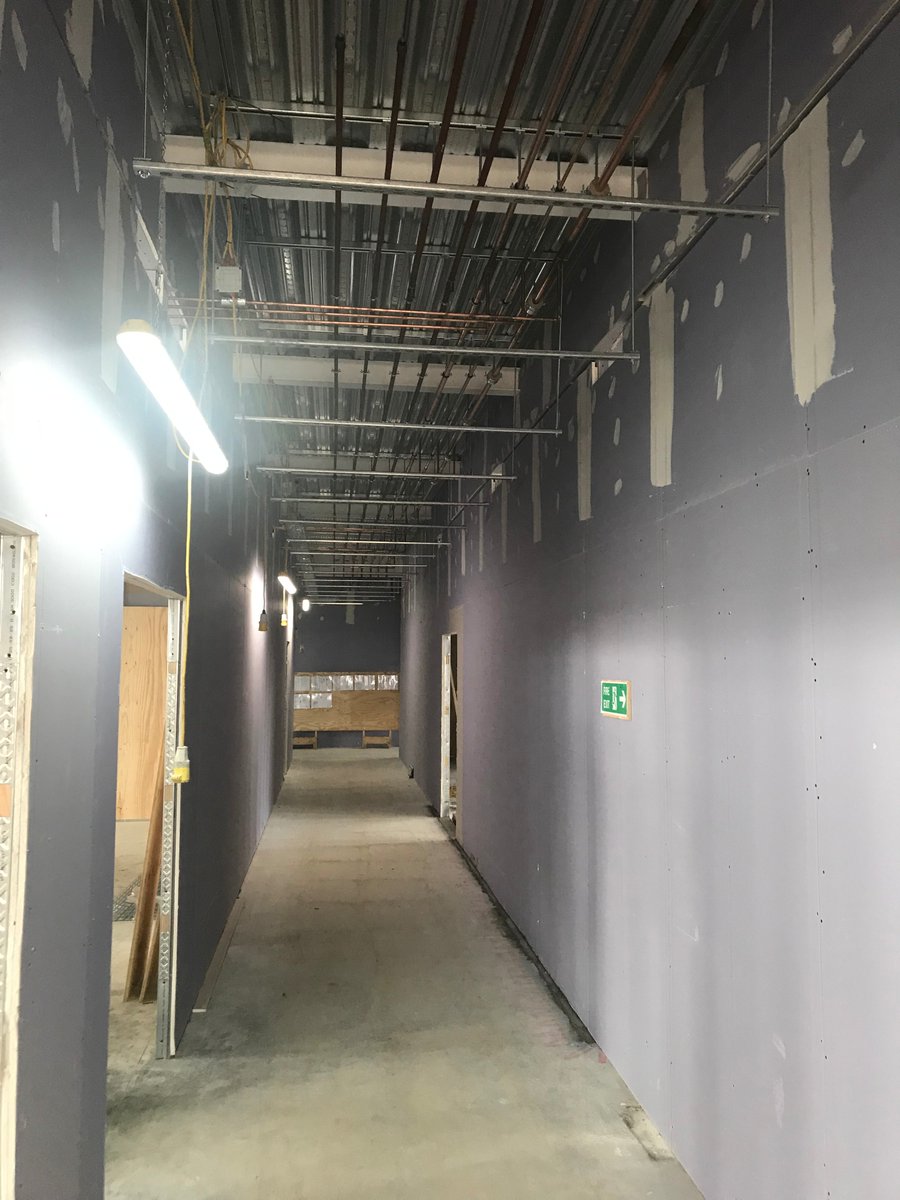 StTheresasICL's tweet photo. Another shot of the brickwork and external windows. First fix partitions and M&amp;E progressing very well too #StTheresas #construction @IRVconstruction https://t.co/5h7Fddg37K