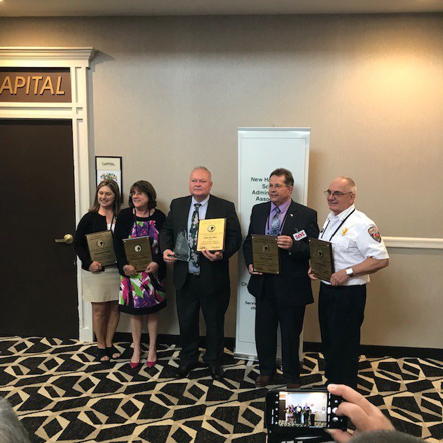 BowManager's tweet photo. Lee Kimball received a Champions for Children Award from the NH School Administrators Assoc. He was recognized for his work keeping our children safe in school and for the guidance and help that he provides to young people and to his players in Bow Youth football. Thank you, Lee. https://t.co/HDt9ckomEA