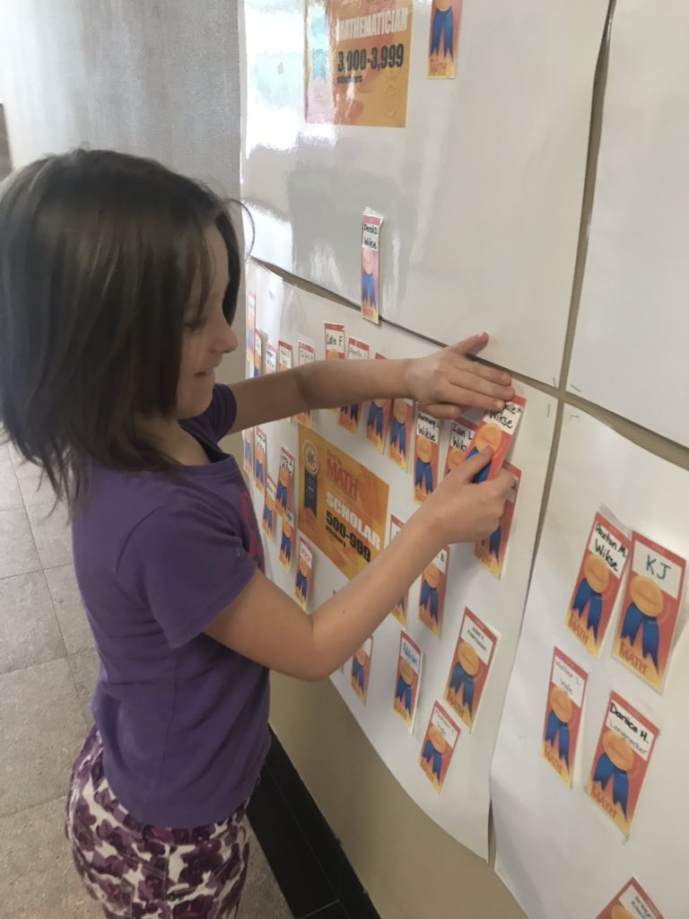 KadeeWikse's tweet photo. Our newest Scholar! I am so proud of her push her at the end of school year to make it on the wall. Our whole class was cheering her on and updating me on her sticker count. I ❤️ them so much!! @ellisorbulldogs @FirstInMath #ees1819 #risetothetop https://t.co/sIwc9HCepi