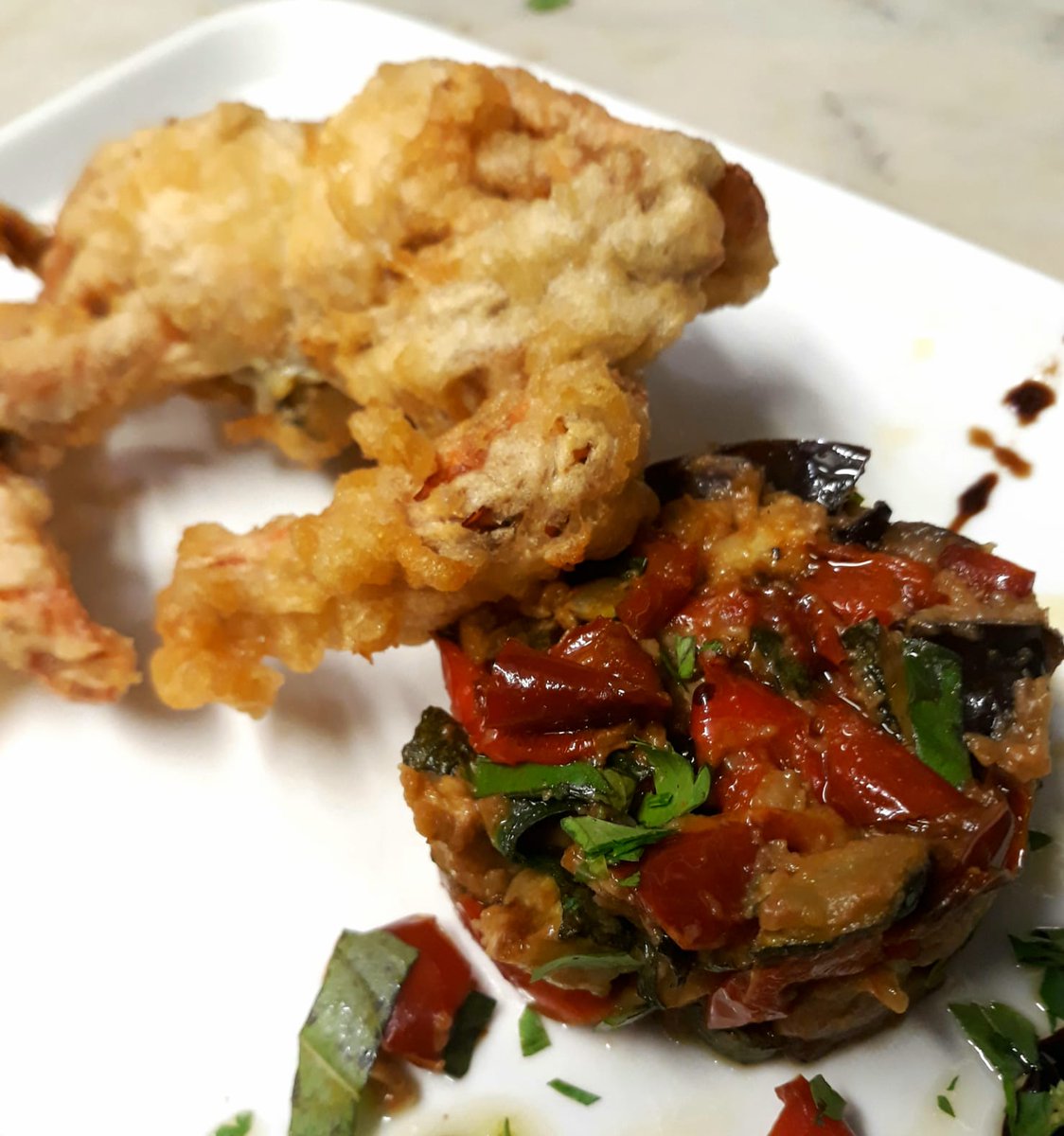 Soft shell crab fried in tempura served with vegetable caponata.
friendsofflavours.london
