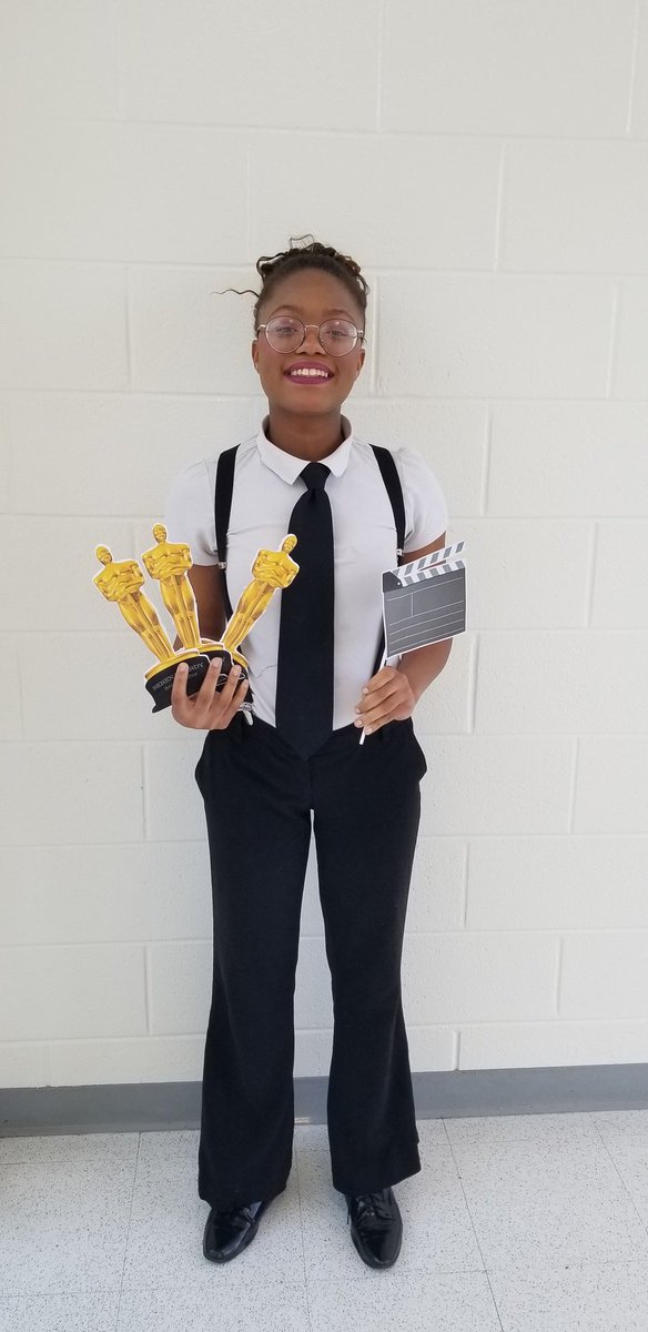 WritingWhs's tweet photo. Today's senior dress-up day is "Dress Like Your Profession" Day. Future Writer/Director Serena Hardy poses with her awards. #ExcellenceandCreativity #destinedforgreatness #whatDramaticWritingcando https://t.co/huWR0j2QPq