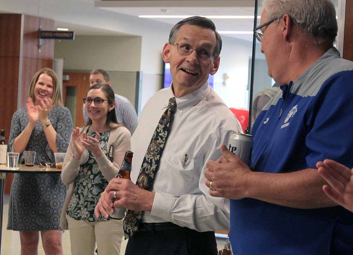 KUPharmacy's tweet photo. Friends, family, and colleagues gathered at the School of Pharmacy in Lawrence to honor Pharmacy Practice Chair Dave Henry, who will retire this year, after 46 years of service to the school and the profession of pharmacy. Congratulations, Dave! https://t.co/IGUjcHE4vE