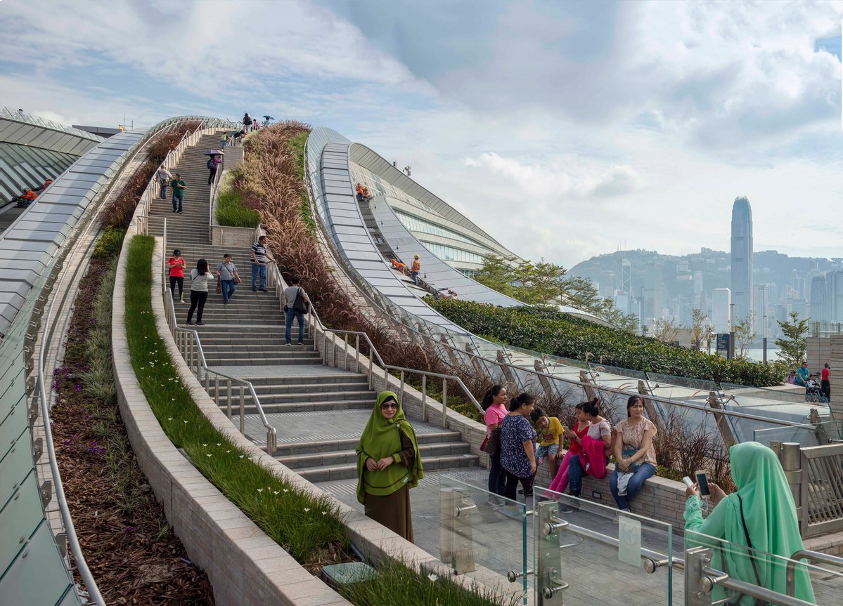 dezeen's tweet photo. Arching rooftop walkway and garden tops West Kowloon Station in Hong Kong by @abromberg_aedas: https://t.co/xJR9zxbcp5 https://t.co/gjRp326Eaj